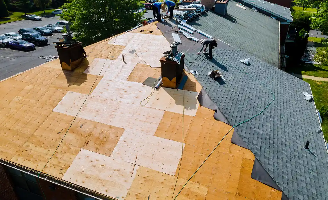 A roofing expert inspecting a roof in Cedar Springs to determine if it needs repair or replacement.