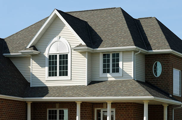 A Michigan home with newly installed gutters highlighting the benefits of seamless or traditional gutters.