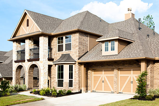 A Michigan home with a roof being inspected as part of a roof repair or replacement guide.