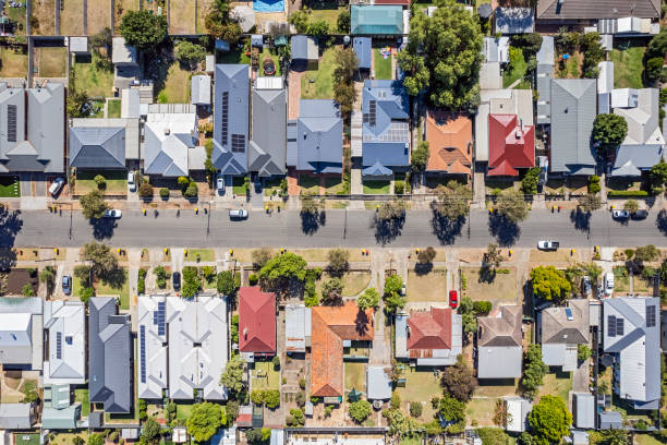 A variety of houses displaying a roofing styles comparison to help homeowners choose the best option.