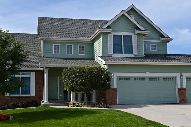 A beautiful Michigan home with a well-maintained roof showcasing winter roof preparation tips for a safe and damage-free season.